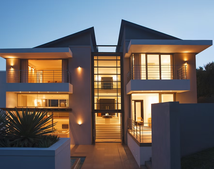 Picture of a modern two-story home taken around dusk
